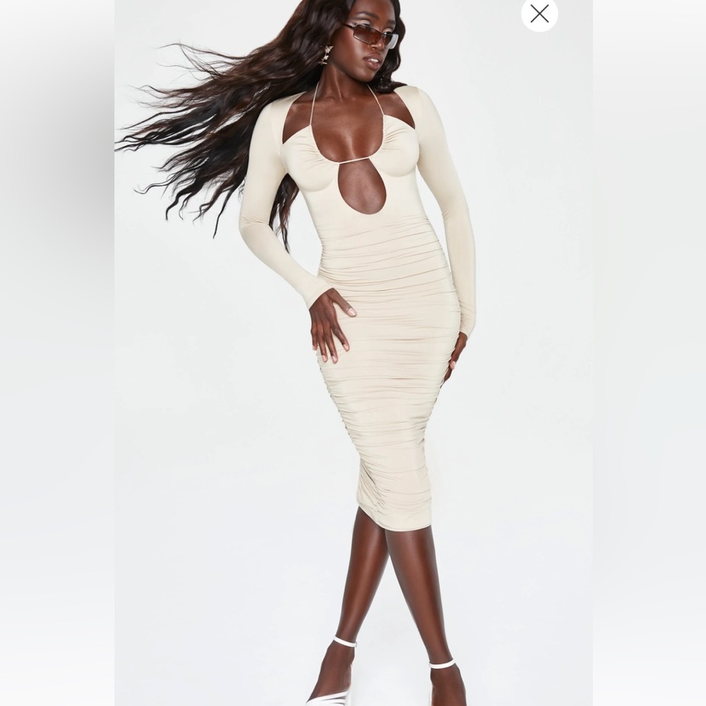 OhPolly bodycon dress with lots of straps , conservative yet sexy